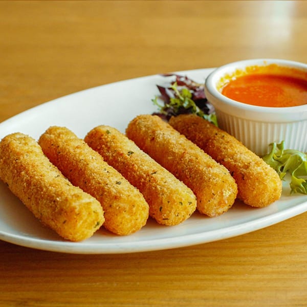 Five golden-brown mozzarella sticks with a side of red dipping sauce and a small salad garnish.